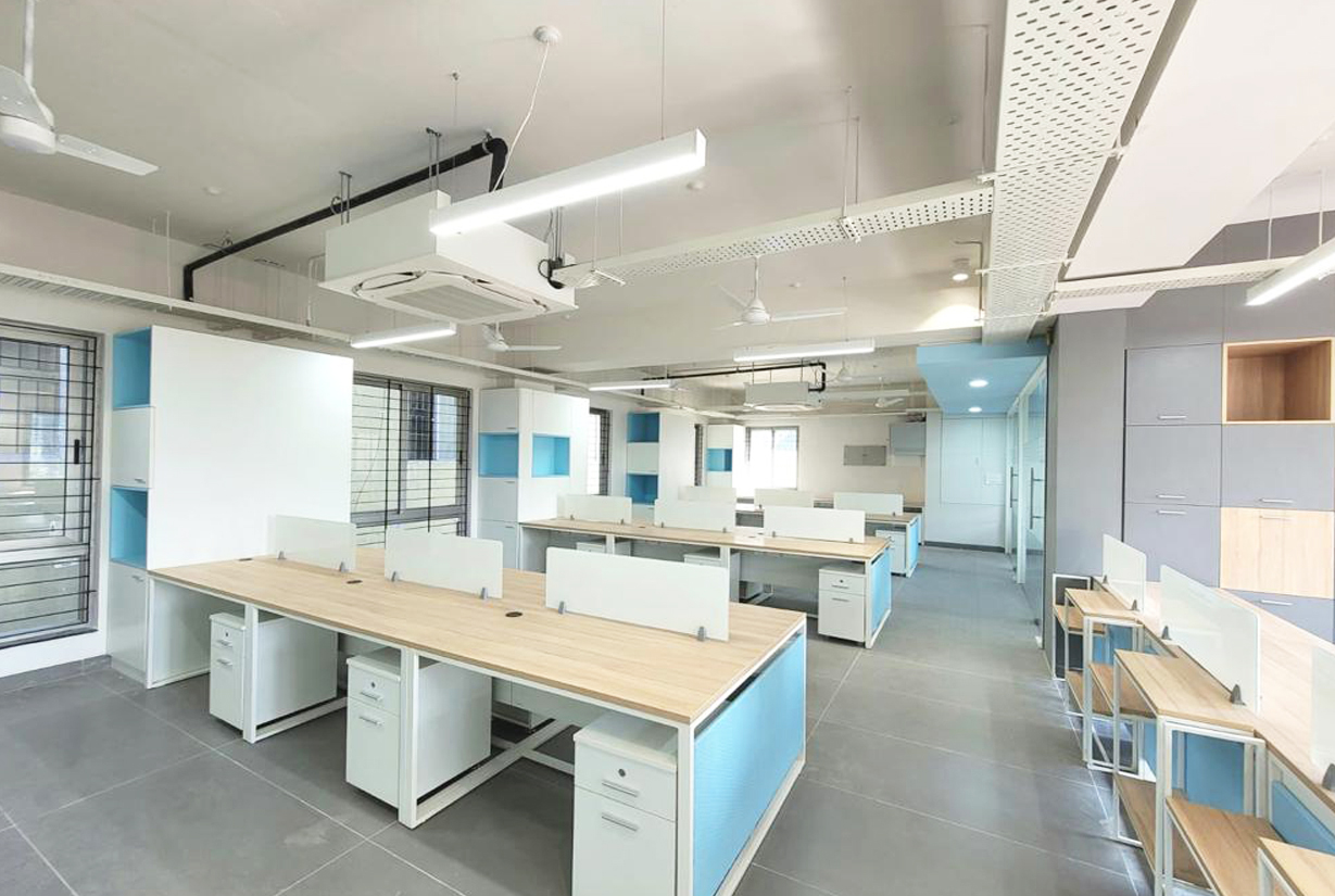 Contemporary office space design featuring open work areas, white
						 partitions, and wooden accents