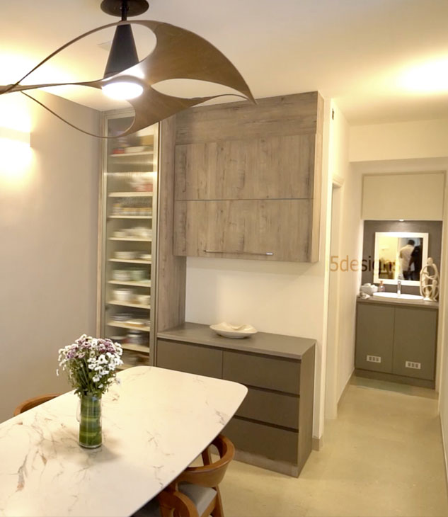 Dining room, minimalist decor, wood cabinetry, floral centerpiece, modern chandelier