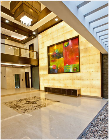 Lobby space, modern art panel, illuminated wall, chandelier, open space design