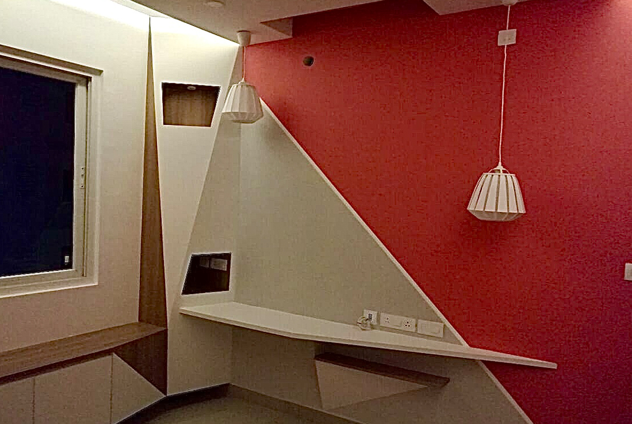 Commercial office area with red and white decorative wall panels and modern
						 lighting accents