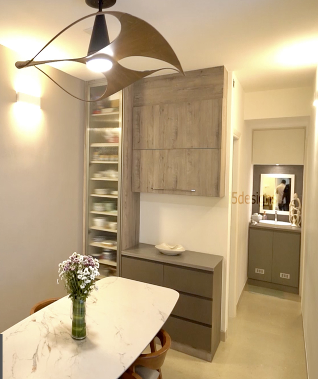 Modern dining area, contemporary lighting fixture,
								 light wood table, minimalist decor