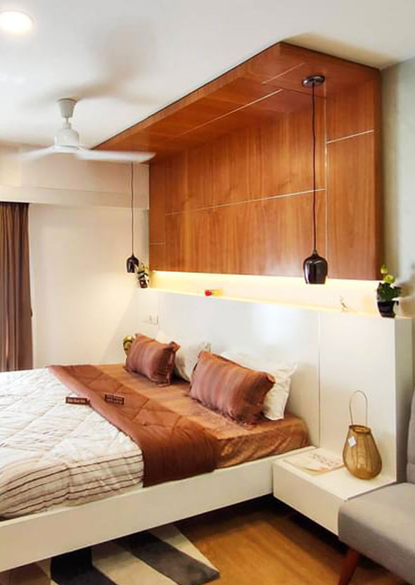 Contemporary bedroom design, wooden
									 ceiling accent, warm lighting, double bed, stylish decor